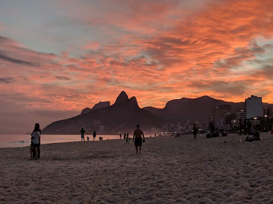 One of the best beaches in Rio de Janeiro: Ipanema Beach at sunset with a view of the Two Brothers mountains. 